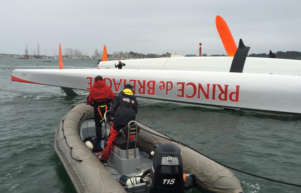 Ultime 80 Prince de Bretagne is towed back into her home port in Lorient after capsizing early in the 2015 Transat Jacques Vabre © Transat Jacques Vabre